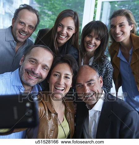 Group of people taking self portrait photograph View Large Photo Image Stock Photograph - Group of people taking self portrait photograph. Fotosearch
