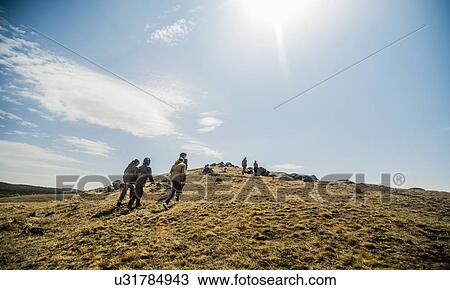 Group of six young adults hiking on mountain View Large Photo Image Stock Image - Group of six young adults hiking on mountain. Fotosearch