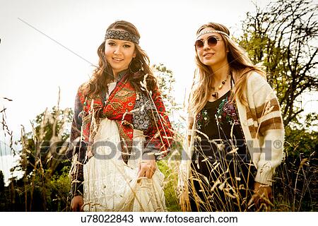 Stock Image - Hippy girls outdoors. Fotosearch