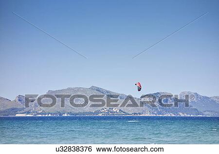 Stock Photograph - Kitesurfer in sea, Majorca, Spain. Fotosearch