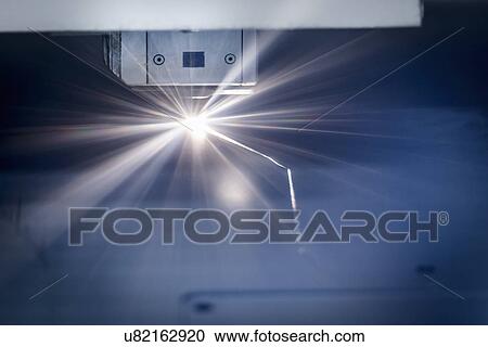 Laser cutter cutting metal in sheet metal factory View Large Photo Image Stock Image - Laser cutter cutting metal in sheet metal factory. Fotosearch