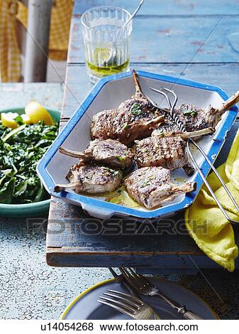 Lemon and mint lamb cutlets View Large Photo Image Stock Photo - Lemon and mint lamb cutlets. Fotosearch