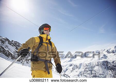 Low angle view of mid adult male skier on mountain, Austria View Large Photo Image Stock Image - Low angle view of mid adult male skier on mountain, Austria. Fotosearch