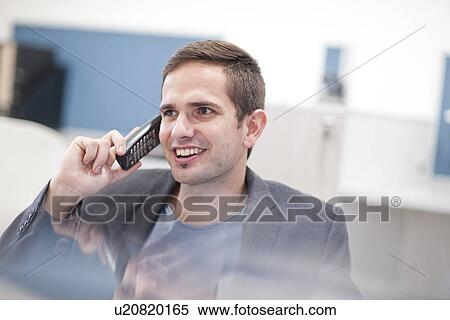 Male office worker on landline phone View Large Photo Image Stock Photography - Male office worker on landline phone. Fotosearch