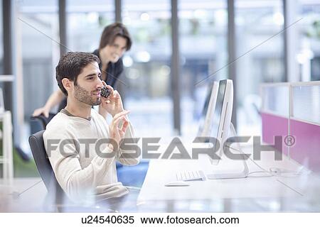 Male office worker on landline phone View Large Photo Image Stock Photography - Male office worker on landline phone. Fotosearch