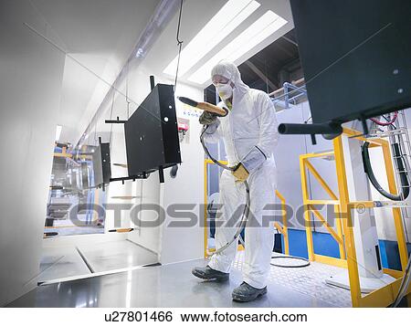 Male worker powder coating parts in paint spray booth in sheet metal factory View Large Photo Image Stock Photograph - Male worker powder coating parts in paint spray booth in sheet metal factory. Fotosearch