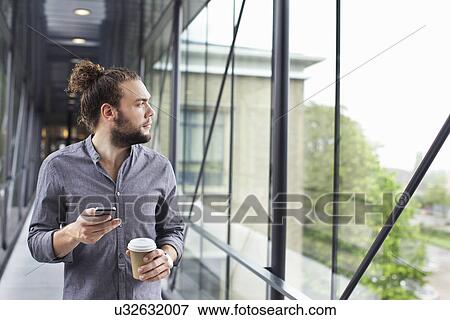 Man with smartphone on coffee break View Large Photo Image Stock Photo - Man with smartphone on coffee break. Fotosearch