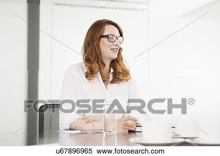 Mid adult businesswoman making presentation in conference room View Large Photo Image Stock Photography - Mid adult businesswoman making presentation in conference room. Fotosearch