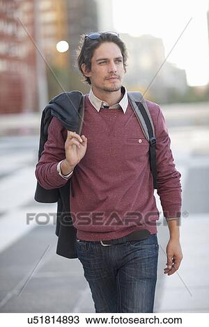 Mid adult man strolling in city View Large Photo Image Stock Image - Mid adult man strolling in city. Fotosearch