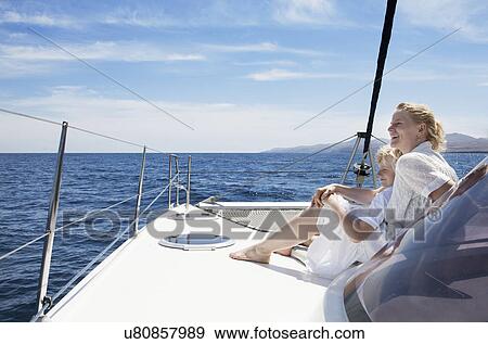 Mid adult mother son sailing on catamaran near Fuerteventura, Spain View Large Photo Image Stock Photo - Mid adult mother son sailing on catamaran near Fuerteventura, Spain. Fotosearch