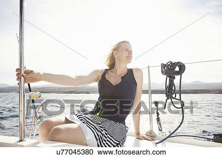 Mid adult woman sailing on catamaran near Fuerteventura, Spain View Large Photo Image Stock Image - Mid adult woman sailing on catamaran near Fuerteventura, Spain. Fotosearch