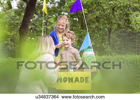 Picture - Mother buying lemonade from daughter's stand. Fotosearch
