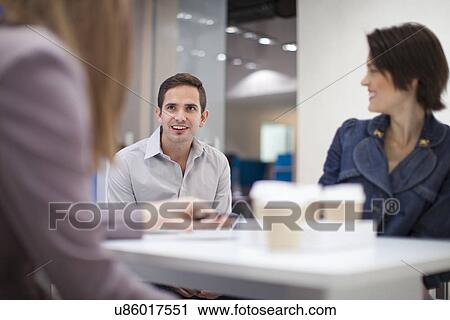 Office colleagues taking a break View Large Photo Image Stock Image - Office colleagues taking a break. Fotosearch