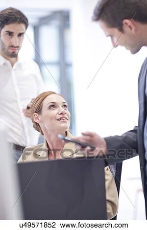 Office colleagues talking View Large Photo Image Stock Image - Office colleagues talking. Fotosearch