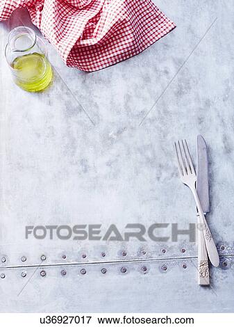 Olive oil, napkin and cutlery View Large Photo Image Stock Photo - Olive oil, napkin and cutlery. Fotosearch