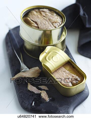 Stock Image - Opened canned tuna. Fotosearch