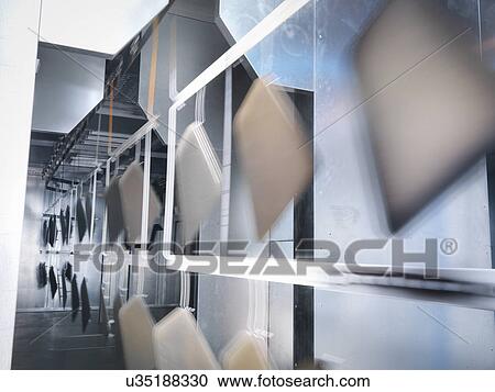 Painted parts in spray booth oven in sheet metal factory View Large Photo Image Stock Image - Painted parts in spray booth oven in sheet metal factory. Fotosearch