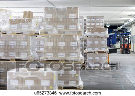 Pallets of stock in warehouse View Large Photo Image Stock Photograph - Pallets of stock in warehouse. Fotosearch
