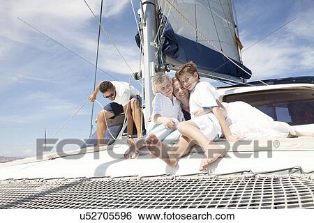 Parents and two sons on catamaran near Fuerteventura, Spain View Large Photo Image Stock Photograph - Parents and two sons on catamaran near Fuerteventura, Spain. Fotosearch
