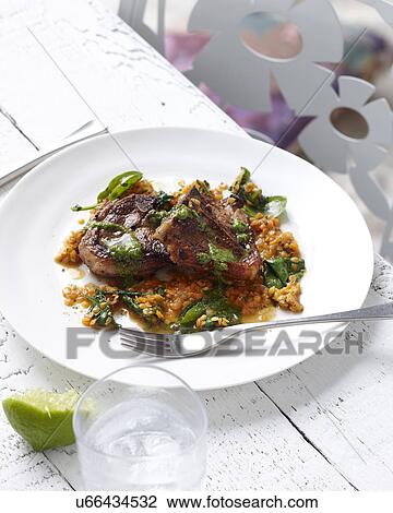 Plate of red lentils with lamb chops and herb garnish View Large Photo Image Stock Image - Plate of red lentils with lamb chops and herb garnish. Fotosearch