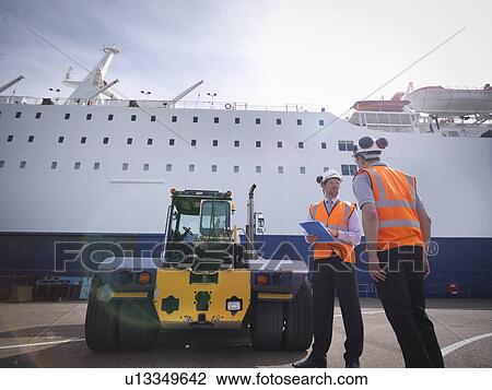 Port workers, shipping container truck and ship in port View Large Photo Image Stock Image - Port workers, shipping container truck and ship in port. Fotosearch