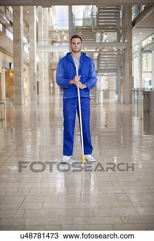 Portrait of male cleaner in office atrium View Large Photo Image Stock Image - Portrait of male cleaner in office atrium. Fotosearch