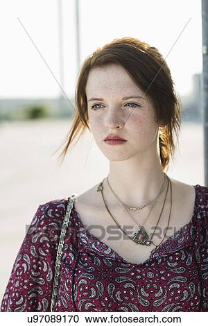 Portrait of serene young woman in empty parking lot View Large Photo Image Stock Image - Portrait of serene young woman in empty parking lot. Fotosearch