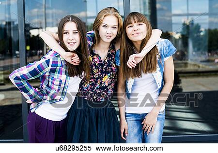 Portrait of three smiling young women in city View Large Photo Image Stock Photography - Portrait of three smiling young women in city. Fotosearch