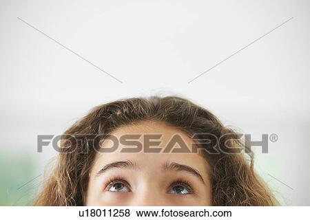 Stock Photo - Portrait of young girl, focus on eyes. Fotosearch