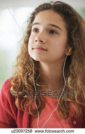 Portrait of young girl wearing headphones View Large Photo Image Stock Photo - Portrait of young girl wearing headphones. Fotosearch