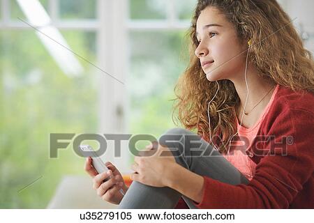 Portrait of young girl wearing headphones View Large Photo Image Stock Photography - Portrait of young girl wearing headphones. Fotosearch