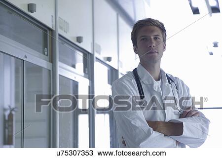 Portrait of young male doctor in lab View Large Photo Image Stock Image - Portrait of young male doctor in lab. Fotosearch