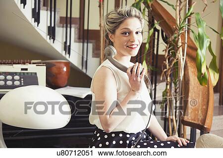 Portrait of young woman in vintage clothes with vintage telephone View Large Photo Image Stock Image - Portrait of young woman in vintage clothes with vintage telephone. Fotosearch