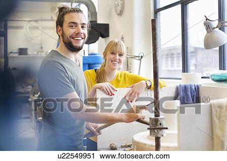 Potter couple working in ceramic workshop View Large Photo Image Stock Image - Potter couple working in ceramic workshop. Fotosearch