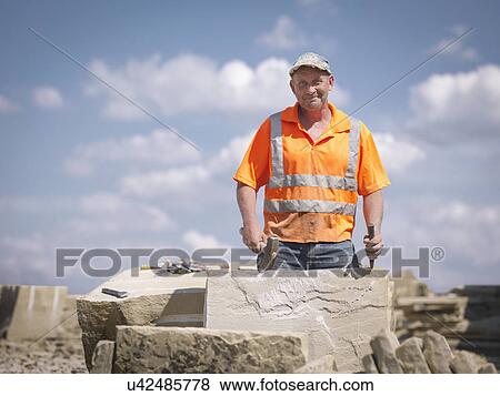 Quarry worker with sandstone in Yorkshire stone quarry, portrait View Large Photo Image Stock Photo - Quarry worker with sandstone in Yorkshire stone quarry, portrait. Fotosearch