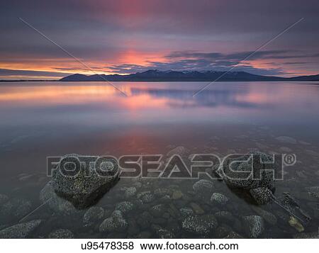 Sea and rocks at sunset, Hvalfjordur, Iceland View Large Photo Image Stock Photo - Sea and rocks at sunset, Hvalfjordur, Iceland. Fotosearch