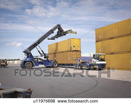 Shipping container stacker in port View Large Photo Image Stock Photo - Shipping container stacker in port. Fotosearch