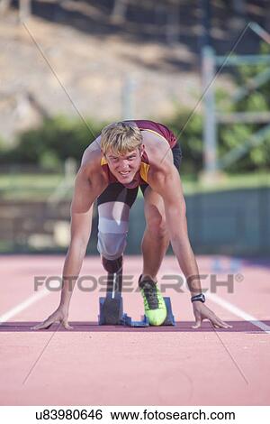 Sprinter in start position View Large Photo Image Stock Photograph - Sprinter in start position. Fotosearch