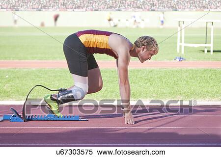 Stock Photography - Sprinter in start position. Fotosearch