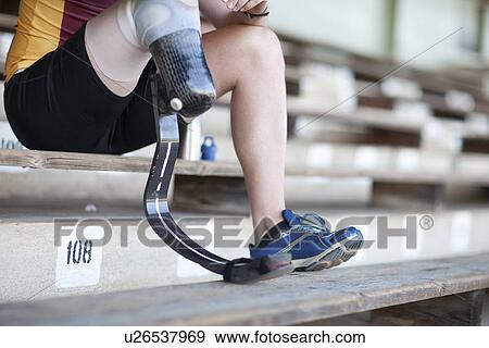 Sprinter sitting with prosthetic leg on View Large Photo Image Stock Photo - Sprinter sitting with prosthetic leg on. Fotosearch