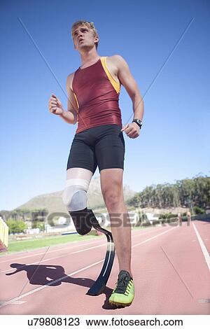 Sprinter standing with prosthetic leg on View Large Photo Image Stock Image - Sprinter standing with prosthetic leg on. Fotosearch