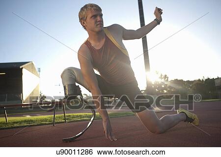 Stock Photograph - Sprinter stretching. Fotosearch