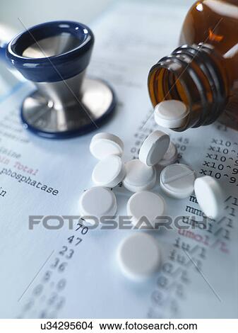 Stethoscope and pain killers pouring onto medical test results View Large Photo Image Picture - Stethoscope and pain killers pouring onto medical test results. Fotosearch