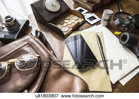 Stock Photo - Still life of group of vintage objects with smartphone. Fotosearch