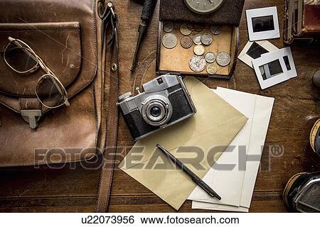 Stock Photograph - Still life of group of vintage objects on table. Fotosearch