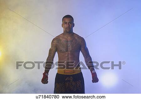 Studio portrait of muscular male boxer in spotlights and mist View Large Photo Image Stock Image - Studio portrait of muscular male boxer in spotlights and mist. Fotosearch