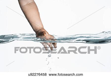 Surface level view of toddlers hand reaching into clear water View Large Photo Image Stock Photo - Surface level view of toddlers hand reaching into clear water. Fotosearch