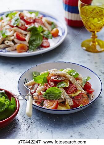 Tomato, basil and pasta salad View Large Photo Image Stock Photo - Tomato, basil and pasta salad. Fotosearch