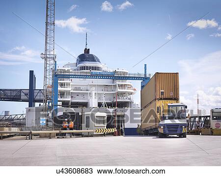 Truck unloading containers from ship to port View Large Photo Image Stock Image - Truck unloading containers from ship to port. Fotosearch