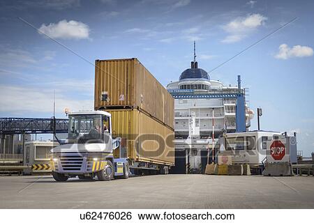 Truck unloading shipping containers from ship to port View Large Photo Image Stock Photograph - Truck unloading shipping containers from ship to port. Fotosearch